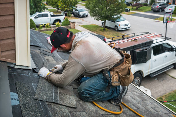 Professional Storm Damage Roof Repair technician working in Mooreland, IN